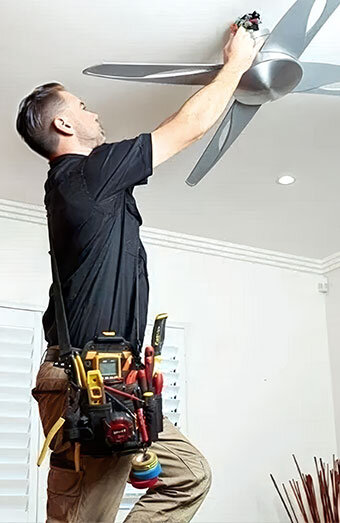/uploads/2025/04/electrician-repairing-ceiling-fan.jpg